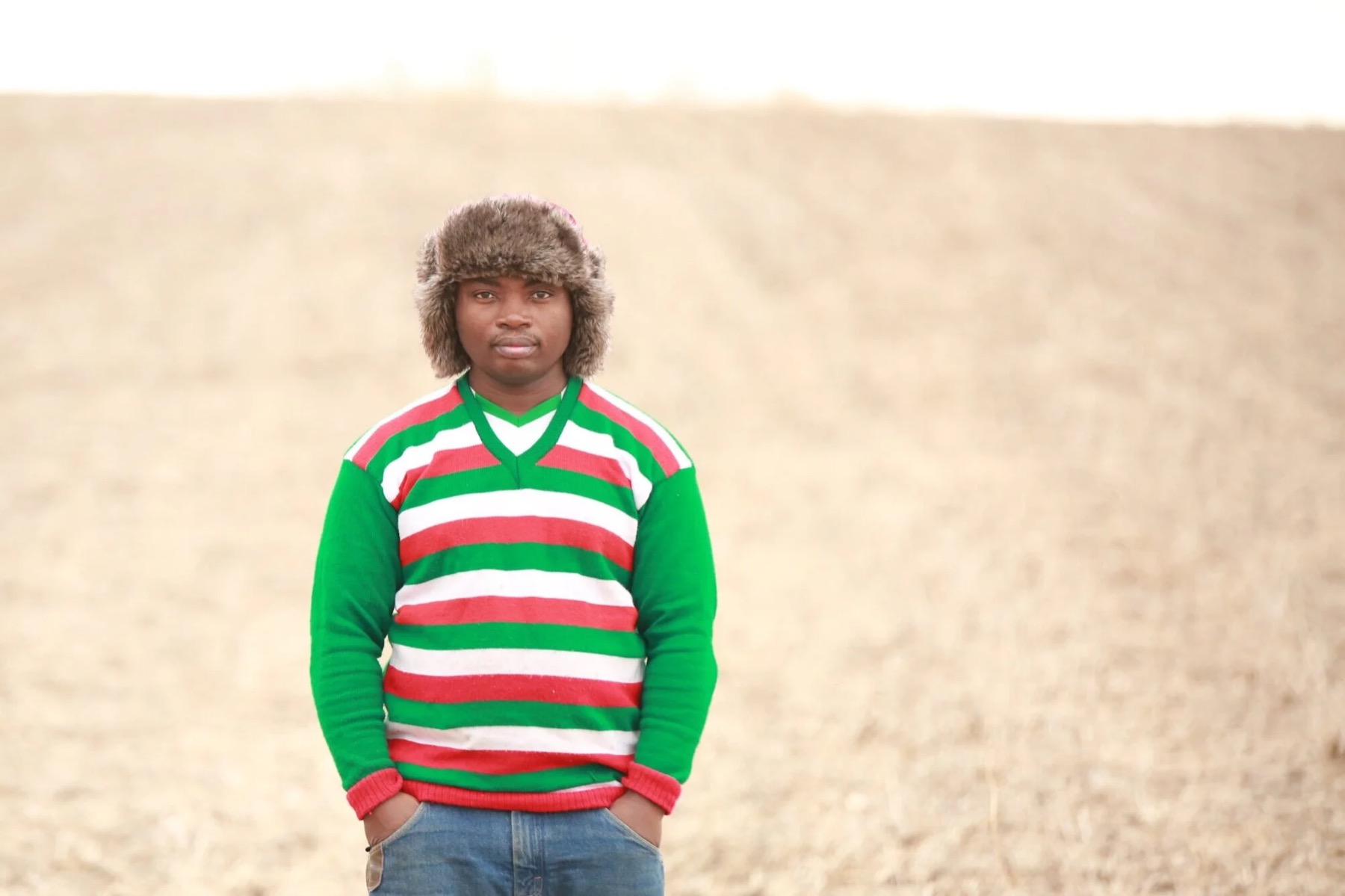 An Equitable Land Access farmer standing in an Iowa field